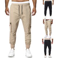 Los nuevos bolsillos simples ocasionales de los hombres con elásticos pantalones del color sólido pantalones Sweatpants corredores streetwear pantalon homme Pantalón cargo