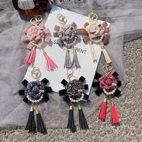 Creative bowknot camellia key chain fashion tassel bag pendant rose accessories car pendant wholesale