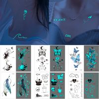 Autocollant de tatouage temporaire d'art temporaire lumineux pour enfants femme homme bleu clair petite fleur dancer noire chat forêt plumique feuille dessin animé conception eau trasnsfer papier