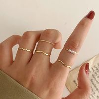 5pcs / set vintage imitation pärla ringar för kvinnor mode guld färg runda våg geometrisk tine ring set bröllopsfest smycken
