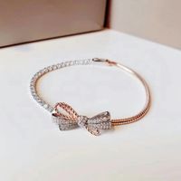 Luxusdesigner Frauen Link Armband Weibliche Schmucksachen Asymmetrische Bogen Knoten Armbänder Importiert V Gold Material