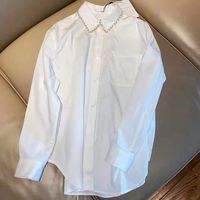 قمصان بيضاء نسائية طويل الأكمام طية صدر السترة عارضة قميص فضفاض تصميم خاص