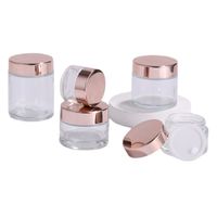 Neue klare Glas-Glas-Creme-Flaschen Runder Kosmetik-Gläser Hand Gesichtscreme-Flasche mit rosafarbener Goldkappe 5g - 100g