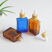 30ml 1oz Amber Blue Color Glass Dropper Bottles Plastic Woodgrain Color Lids Cosmetic Essential Oil Drop Packaging Container Personal Care