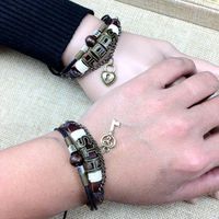 Bedelarmbanden Paar armband Een paar leerleer exotische hand-geweven slot sleutel toeristische souvenir sieraden display affectie persoon