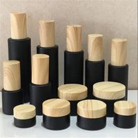 Black Frosted Glass Cosmetic Bottle Cream Jars Spray Lotion Bottles Refillable Container with Wood Grain Plastic Lids