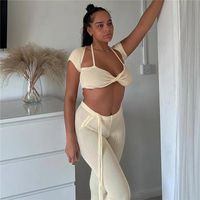 سروالين للسيدات المكون من قطعتين Aobiu Solid 2 مجموعات المرأة ملابس Slim Flare Sexy Halter Lace Up Short Sleeve Tops Tops Fime 2022 Summer