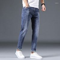 Jeans masculinos Spring e Autumn Clothing Fashion Troushers de algodão casual se estendem reto no meio da cintura Slim-Fit