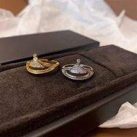 Anillo de diamantes de lujo de clúster para mujeres de 18 km de oro y plateado Saturno Planeta Rings Diseñador de moda Joyería Accesorios de dedos encantadores Regalo con Glam Box