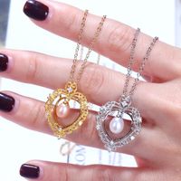 Chaines Pendre du cœur vintage Colliers de perles d'eau douce creux bijoux de mode pour les femmes