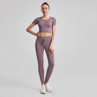 Kadın yoga Out Fit yüksek bel koşu iplik güçlü streç düz renkli naylon zindelik kısa kollu ve cep pantolonları takım elbise dikişsiz kalça kaldırma tozluk izleri