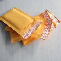 Embrulho de presente 10pcs 90*130+40mm kraft saco de bolhas envelopes acolchoados mala direto bolsas amarelas