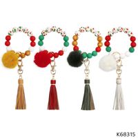 Keychains 1pcs Joyas de navidad Pulseras de encanto con protector de tasel de pompo