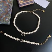Diseñador de moda acero inoxidable letra amor collar perla collares mujeres colgantes retro encanto cadena colgante joyería regalo