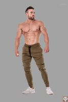 Pantalones de entrenamiento de Muscle Brothers Pantalones de fitness delgados de los hombres.