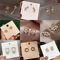 Dangle Kronleuchter koreanischer Ohrringe für Frauen langer Zirkon Schmetterling Blume Pearl Metal Häkelohren Mode Schmuck 2022 Großhändler