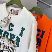 Mens Tiger T Shirt Tasarımcısı 2022 İlkbahar ve Yaz Trend Mektubu Hayvan Baskı Çiftleri Yuvarlak Boyun Erkekler İçin Gevşek Üstler Kadınlar Artı Boyut Klasik