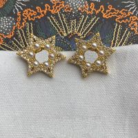 Schmuckdesigner Bolzen Ohrringe Hochzeit für Frauen Mädchen Teen Damen Fünf spitze Star weiße Perlstars Mode Luxus Gold plattiert Kupfer Kubikzirkonia Diamant Diamant