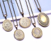 Unikalny rzeźbiony design miedziany owalny rama fotograficzna wisiorek urok otwartych naszyjniki medalia kobiety mężczyźni pamięci biżuteria
