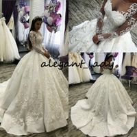 Luxury Sparkly Puffy Wedding Dresses 2020 Sheer O-neck Long Sleeve Lace-up Corset Back Beaded Crystal Arabic Princess Wedding Gown