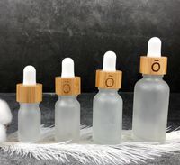 5 10 15 ml 30 ml 50 ml botellas de gotero de cristal transparente escarchado con tapa de bambú 1oz bambúes botella de aceite esencial logotipo personalizado