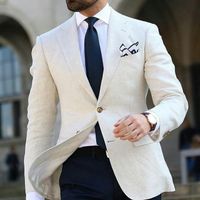 beige jacket blue trousers