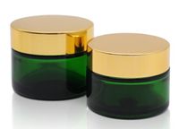 Wholesale 50g ml green glass jar with gold black silver white lid cap cosmetic cream wax glass container stash jar custom logo