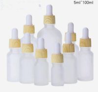 Wholesale Vape ml frosted glass dropper bottle essentail oil bottle matte round bottles with wood grain White pipette for cosmetic packaging custom