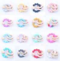 Wholesale Baby Teether Rings Food Grade Beech Wood Teething Ring Soothers Chew Toys Shower Play Chew Round Wooden Bead Silicone teether DYP1019