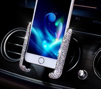 Wholesale Car air outlet mobile phone holder diamond gravity induction car bracket air outlet snap on mobile phone holder with drill