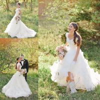Wholesale Tiered Skirts Modest Wedding Dresses Arabic Beaded Lace Country Wedding Gowns Cascading Ruffles Ivory Buttons Back Cowboy Boots