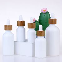 Wholesale 10 ML White Porcelain Dropper Bottles with Bamboo Cap For Essential Oil Perfume Packaging Dropper Bottle Empty Cosmetic Container
