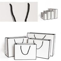 Wholesale DHL Ship Kraft Paper Thicken Bags White Card Packaging Bag Advertising Fashion Storage Handbag Shopping Party Customized Clothing
