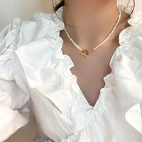 Wholesale Pendant Necklaces Fashion Hollow Metal Small Flowers Irregular Natural Freshwater Pearl Necklace Simple Clavicle Chain Toggle Clasp Women Je