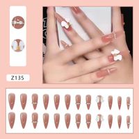 Wholesale False Nails Fake Nude Pink D Bow Nail Art Sweet Style Glue Type Removable Pointed Long Paragraph Full Cover Artificial Manicure