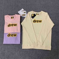 Wholesale Ouyang Nana s Same Drew Smiling Face Cream Yellow Letter Loose Round Neck Sweater for Men and Women Couples Long Sleeve Top Fashion