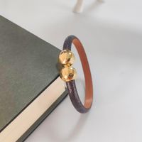 Wholesale Luxury Jewelry Feminine Leather Designer Bracelet with Gold Heart Brand logo on a high end elegant fashion bracelet holiday gift