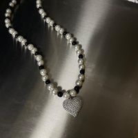 Wholesale Pendant Necklaces Black And White Stitched Bead Necklace Quality Full Of Modern Pearl Match