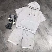 Wholesale High version spring and summer new fashion Saijia rivet irregular cutting simple casual hooded couple suit