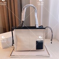 Wholesale 2021Designer shopping bag made of canvas and leather with classic elements simple style oversized portable beach bags