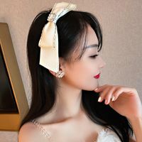 Wholesale Pearl bowknot water drill headband fashion contracted and sweet flannelette headdress web celebrity temperament design hair act the role ofing female
