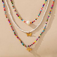 Wholesale Womens pendant necklaces golded silver Creative Butterfly colorful rice bead clavicle chain Bohemian short Pearl Necklace piece set