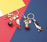 Wholesale Japanese Anime Maneki Neko Lucky Cat Fortune Tassel Gold Plated Keychain Key Chain Car For Women Bag Pendent Charms D667 Keychains