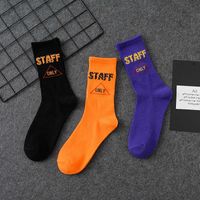 Wholesale Orange letter socks men s and women s fashion personality hip hop European and American street middle tube socks Korean Basketball socks