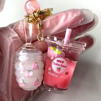 Wholesale Peach Moisturizing Lipgloss Fruit Scent Women s Keychain Lip Gloss Vegan Glitter Set Vendor
