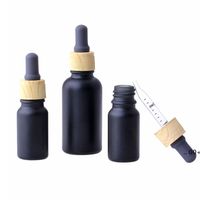 Wholesale Matte Black Glass e liquid Essential Oil Perfume Bottle with Reagent Pipette Dropper and Wood Grain Cap ml FWF11410