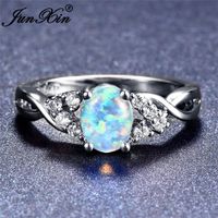 Wholesale junxin mystic rainbow oval stone blue fire opal crossed rings for women white gold filled female wedding bands
