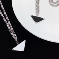 Wholesale 2021 Titanium steel Luxury designer Jewelry womens mens necklace chain charm fashion charmet love couple silver black white Inverted triangle Pendant Necklaces