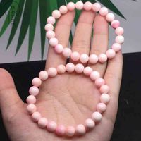 Wholesale Natural pink shell bracelet women s single ring simple pink shellfish hand jewelry striped hand string material is delicate