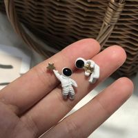 Wholesale Wandering Earth Japanese Star Picking Astronaut Spaceman White Stereo Asymmetrical Stud Earrings For Women Girls Children